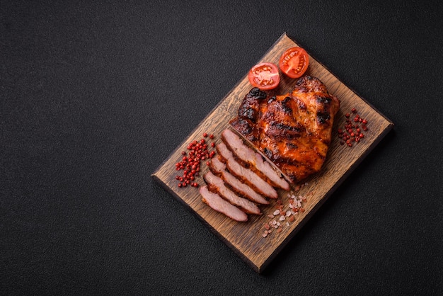 Fresh juicy delicious beef steak on a dark background