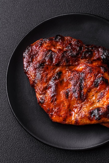 Fresh juicy delicious beef steak on a dark background