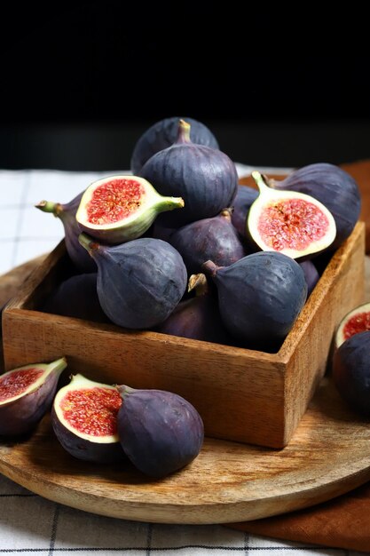 Fresh juicy figs in a wooden box