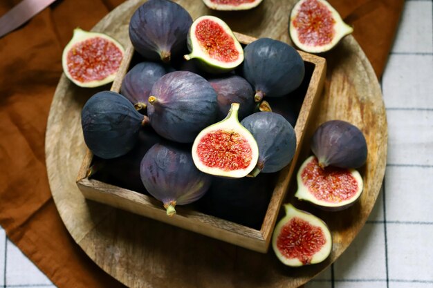 Fresh juicy figs in a wooden box