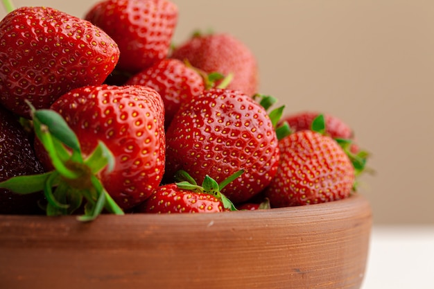 Fresh juicy large strawberry in a bowl.