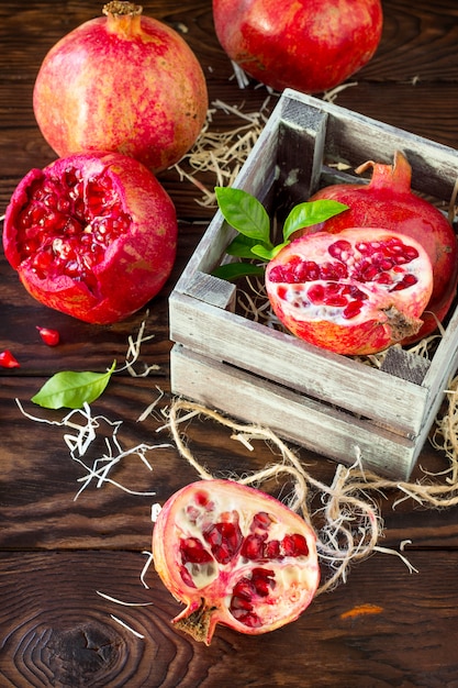 Fresh and juicy pomegranate in a wooden box