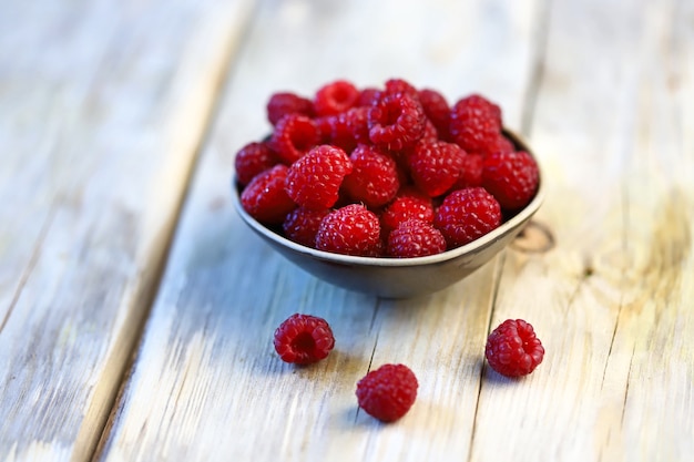 Fresh juicy raspberries in a bowl.