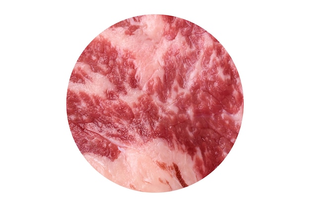 fresh juicy raw beef striploin steak with salt and spices on a dark concrete background