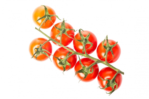 Fresh juicy red cherry tomato bunch closeup isolated .