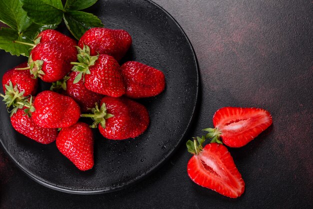 Fresh juicy strawberries with leaves. Fresh summer crop of strawberry berries