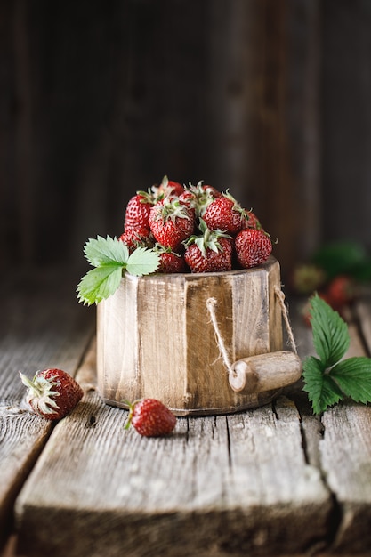 Fresh juicy strawberry on wooden table.