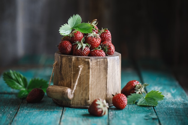 Fresh juicy strawberry on wooden table.