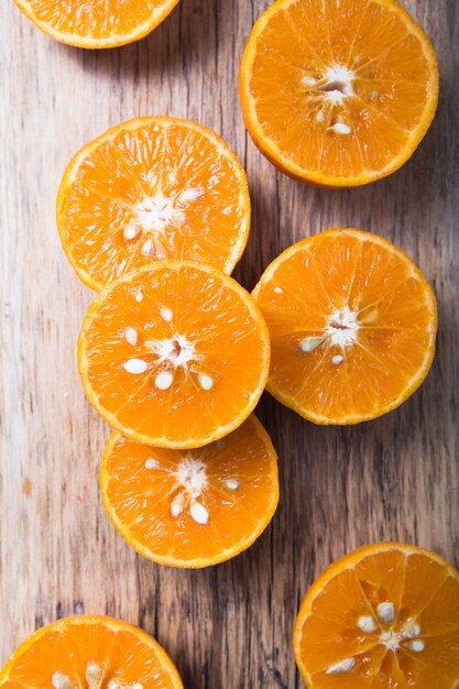 Fresh juisy chopped orange half  pieces or tangerine food background