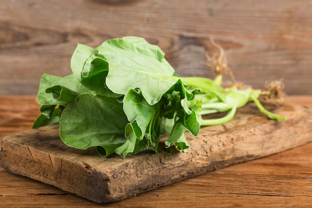 Fresh kale salad on wooden table