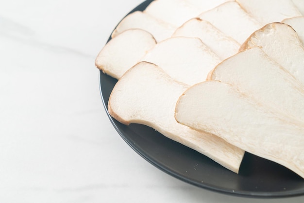 fresh King oyster mushroom or King trumpet mushrooms on plate