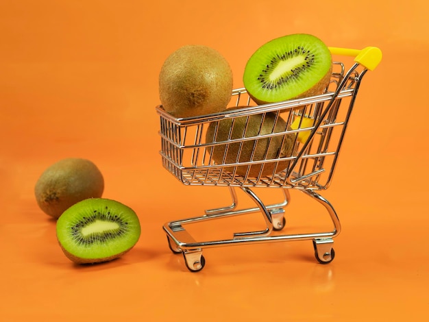 Fresh kiwi in the cart Background for text buy kiwi