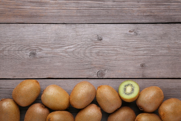 Fresh kiwi fruit on grey wooden background