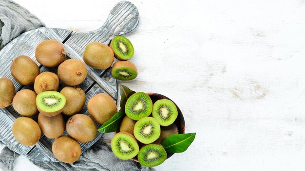 Fresh kiwi on a white wooden table Rustic style Fruits Top view Free space for text