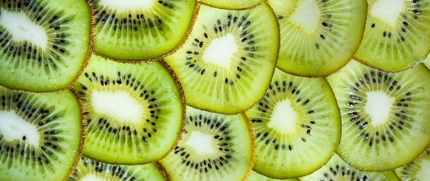 Fresh kiwifruit background round slices closeup