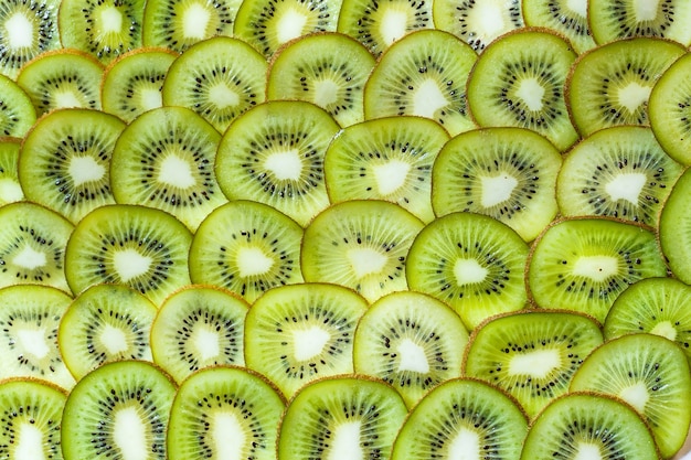 Fresh kiwifruit background. round slices closeup