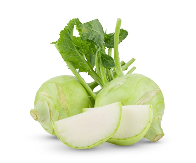 Fresh kohlrabi with green leaves on isolated white