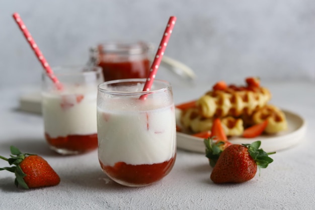 Fresh Korean strawberry milk with strawberry compote in bright white background