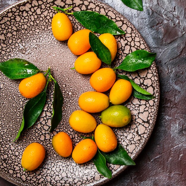 Fresh kumquat with leaves top view