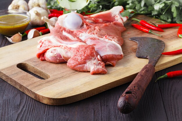 Fresh lamb on a board with a knife