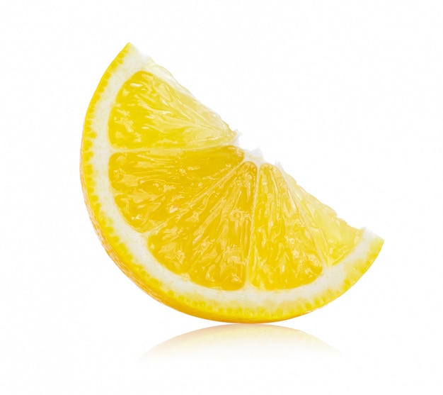 Fresh lemon slices on white wall