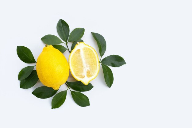 Fresh lemon with green leaves isolated