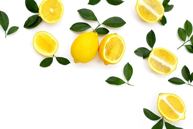 Fresh lemon with green leaves on white background.