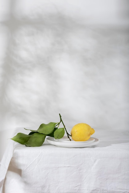 Fresh lemon with green leaves