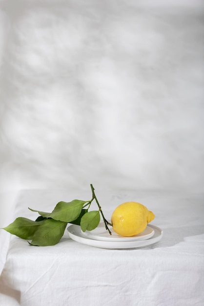 Fresh lemon with green leaves