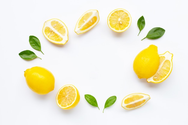 Fresh lemon with leaves isolated on white 