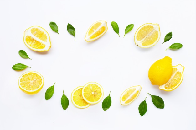 Fresh lemon with leaves isolated on white 