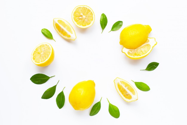 Fresh lemon with leaves isolated on white 