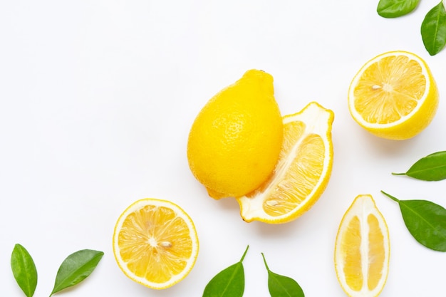 Fresh lemon with leaves isolated on white