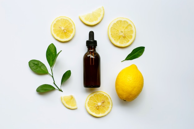 Fresh lemon with lemon essential oil.