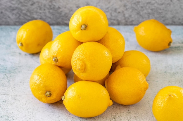 Fresh lemon Yellow lemon on stone background close up