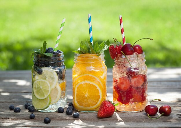 Fresh lemonade jar with summer fruits and berries