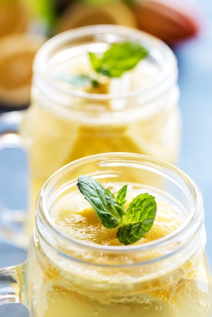 Fresh lemonade in mug jar with ice and mint