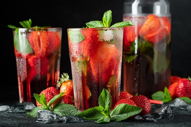 Fresh lemonade with ice, mint and strawberry.