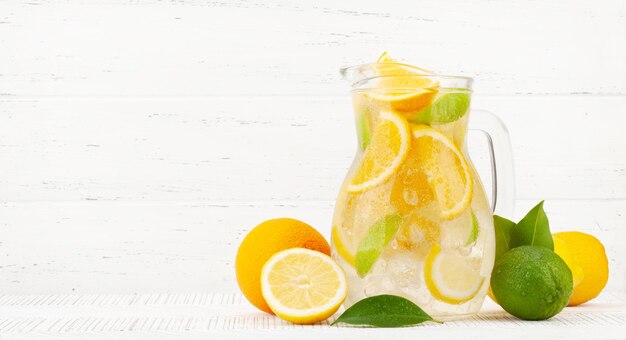 Fresh lemonade with ripe citrus fruits