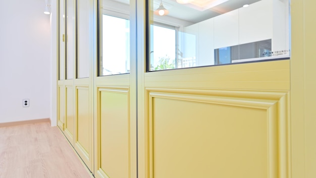 Fresh lemoncolored folding doors make the house feel light