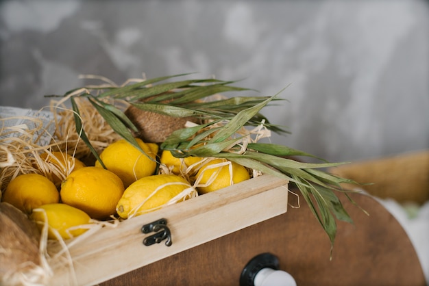 Fresh lemons are in a wooden box