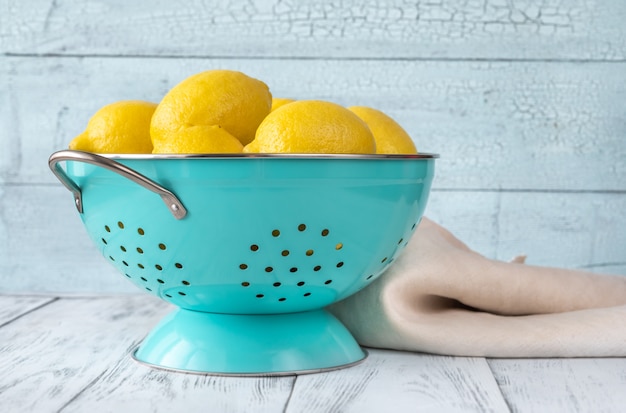 Fresh lemons in the colander