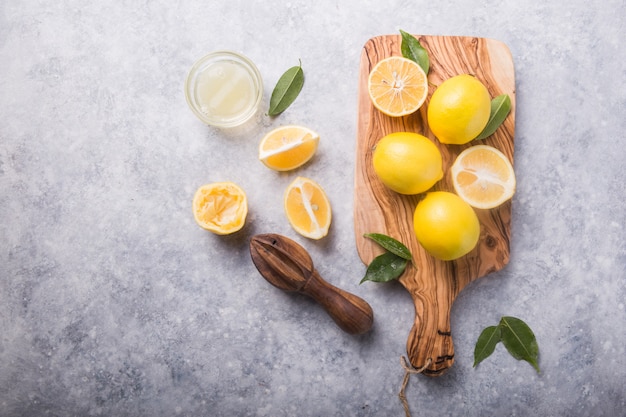 Fresh lemons on cutting board