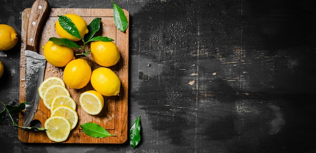 Fresh lemons on the cutting board