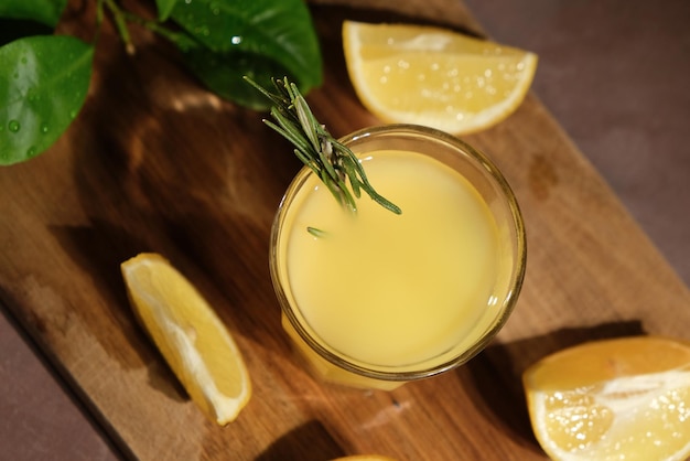 Fresh lemons and shot glass of limoncello