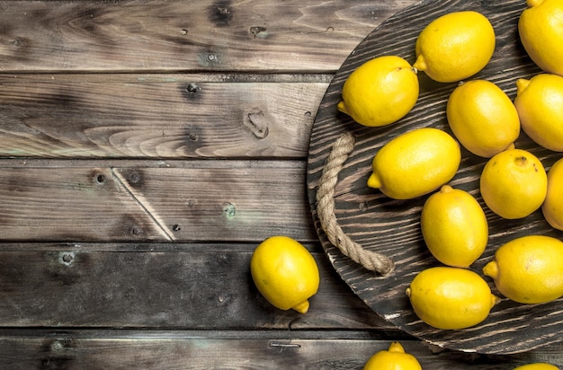 Fresh lemons on tray