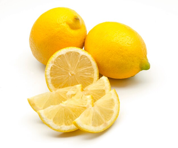 Fresh lemons on white surface