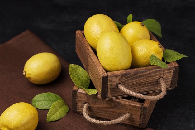 fresh lemons in a wooden box