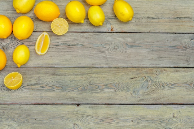 fresh lemons on wooden table.