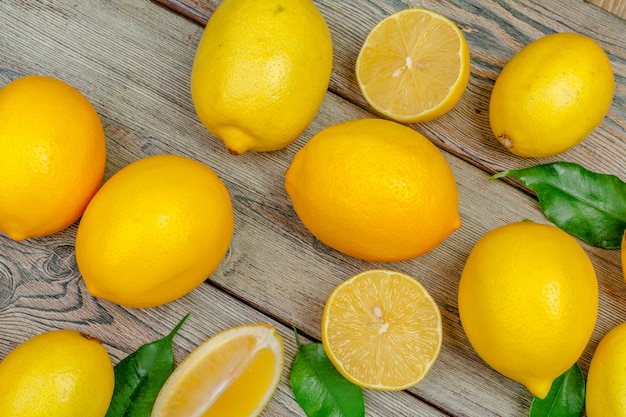 fresh lemons on wooden table.